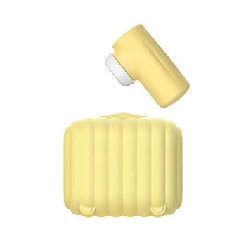 Imevä klitoriskiihotin desinfioivalla kotelolla, keltainen